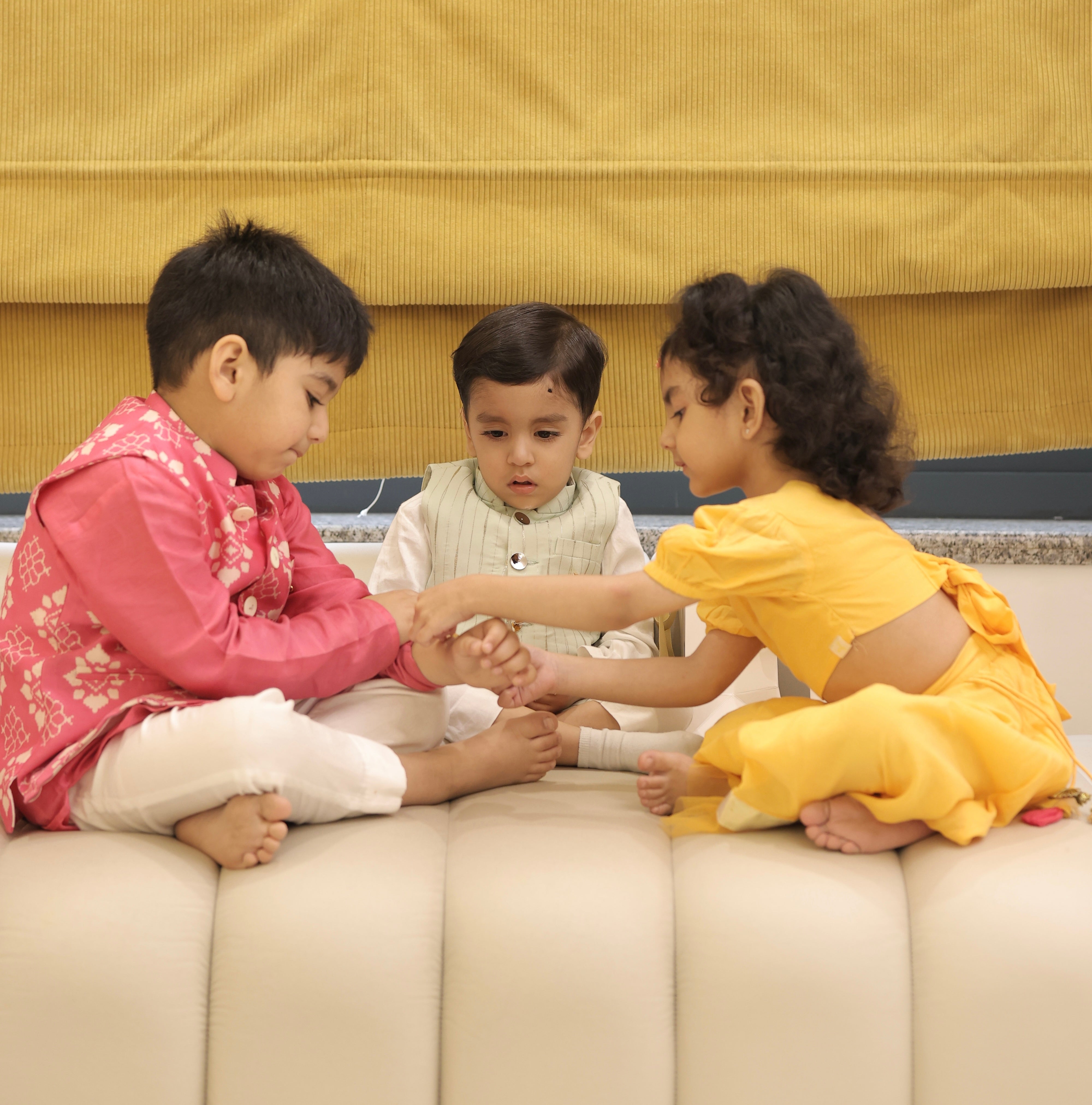 Baby and kids silver and gold rakhi bracelets by Rajasi Jindal