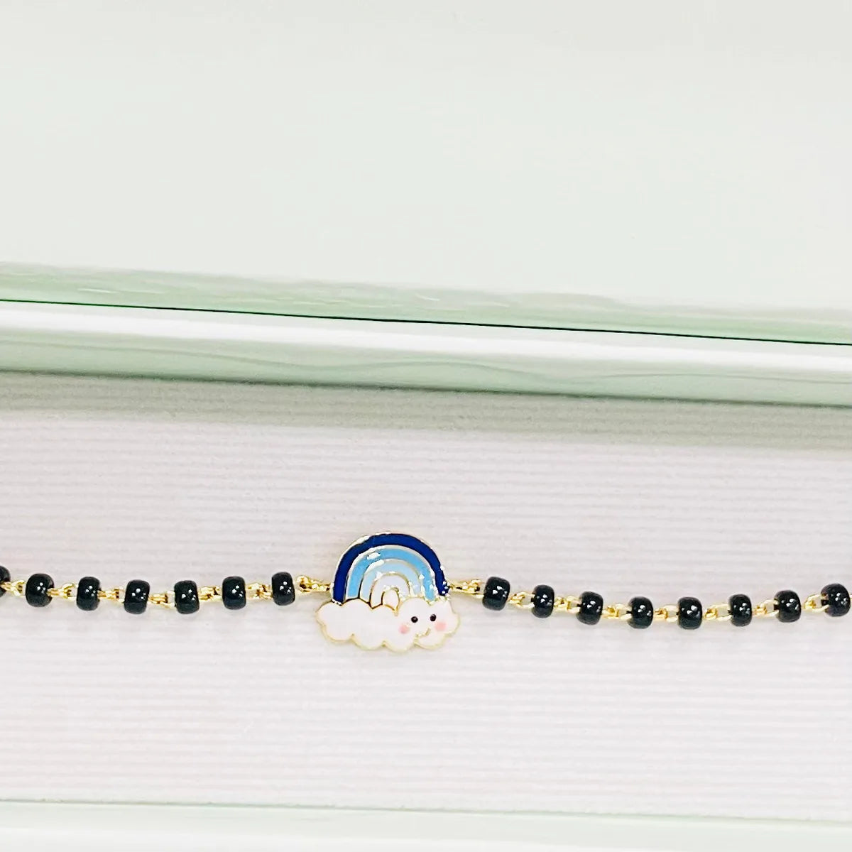Rainbow Blue Gold Nazariya for babies — BIS Hallmarked gold evil eye, by Rajasi Jindal