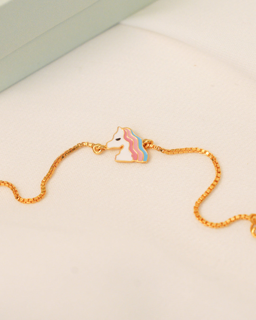 Gold bracelet with unicorn cham 