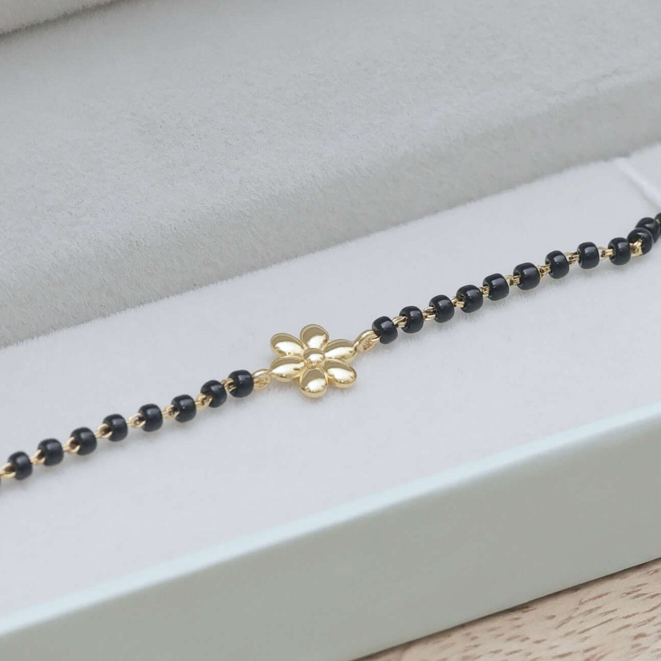 Golden Flower Nazariya for babies — BIS Hallmarked gold evil eye, by Rajasi Jindal