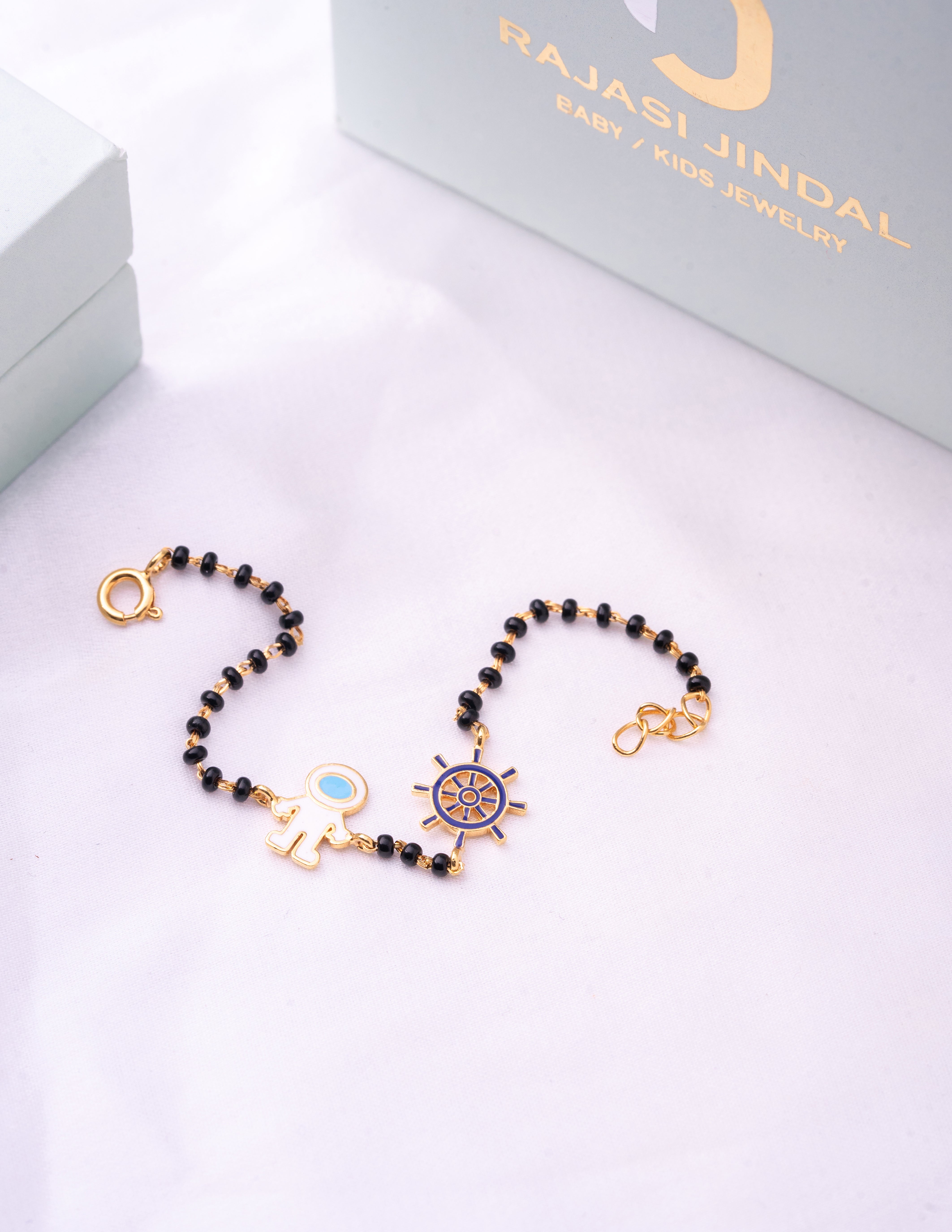 Spaceman Sailor Wheel Gold Nazariya for babies — BIS Hallmarked gold evil eye, by Rajasi Jindal