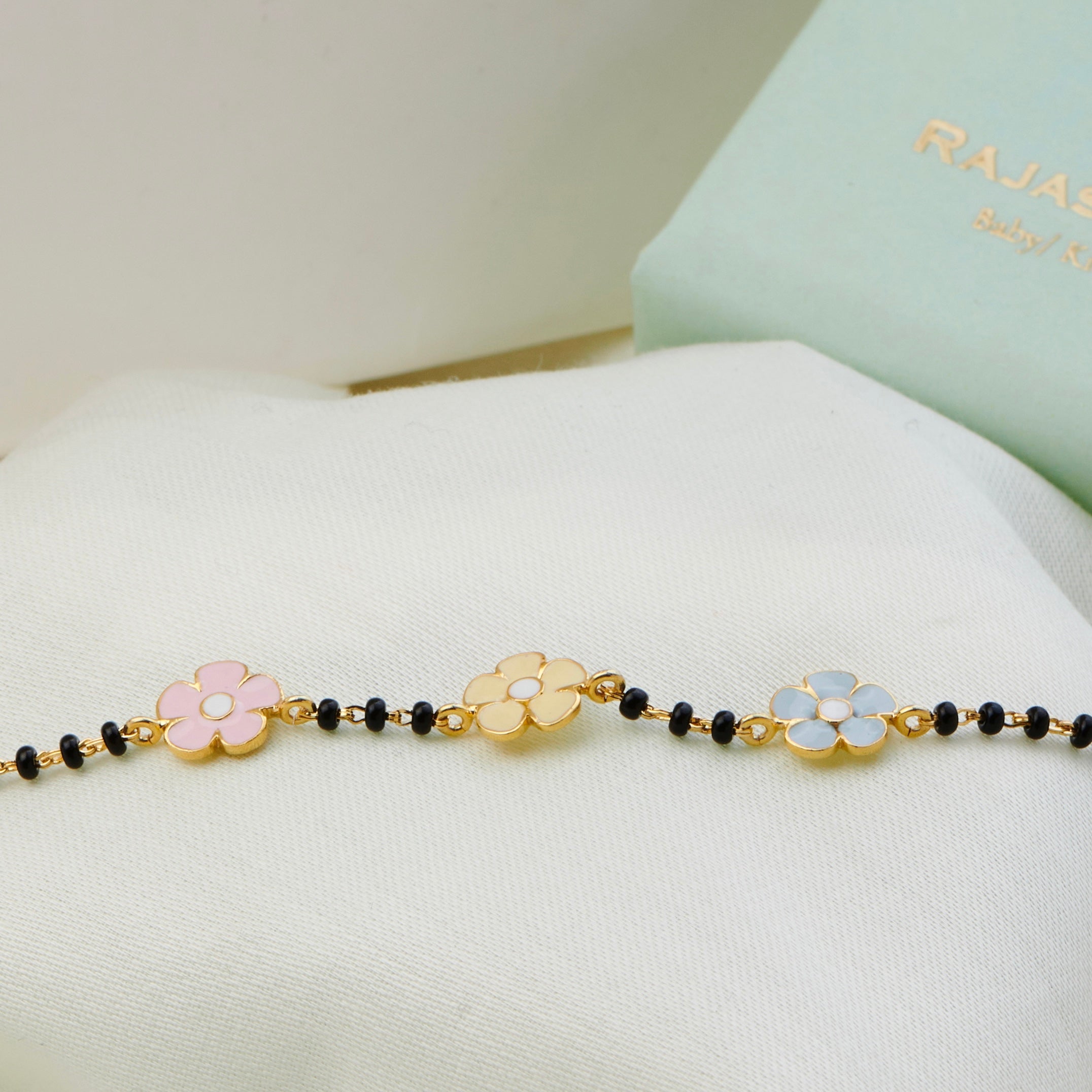 Blooming Flowers Gold Nazariya for babies — BIS Hallmarked gold evil eye, by Rajasi Jindal