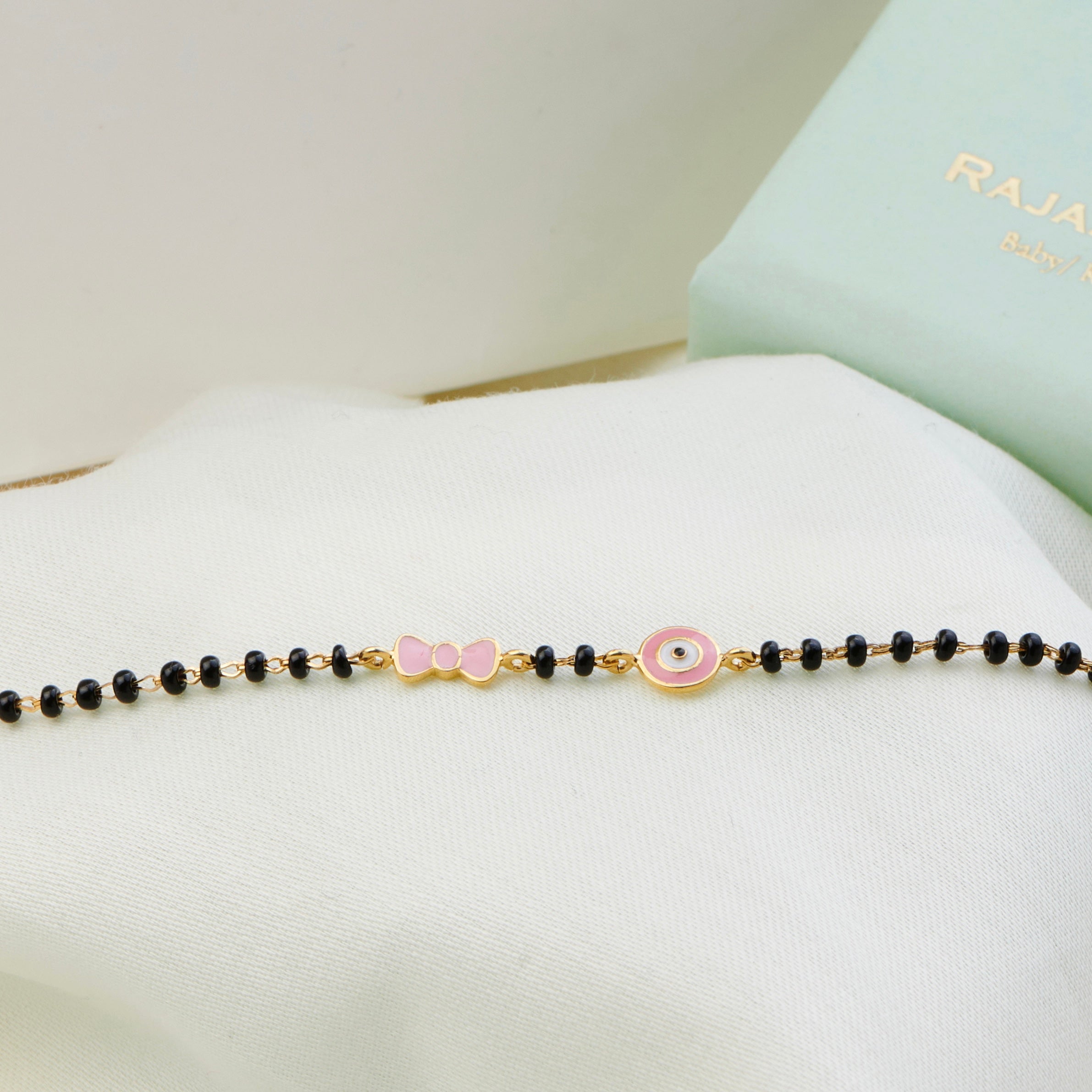 Bow Evil Eye Gold Nazariya for babies — BIS Hallmarked gold evil eye, by Rajasi Jindal