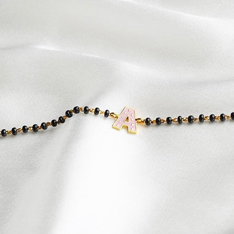 Pink Initial Gold Nazariya for babies — BIS Hallmarked gold evil eye, by Rajasi Jindal